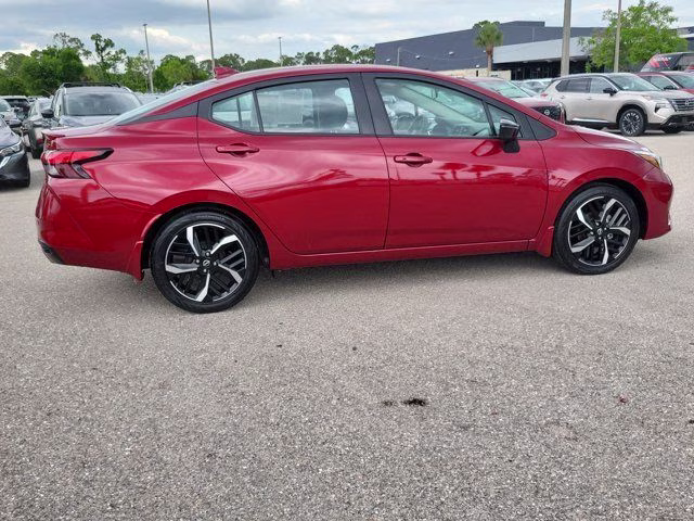 2025 Scarlet Ember Tintcoat Nissan Versa 1.6 SR FWD Sedan