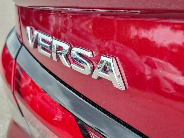 2025 Scarlet Ember Tintcoat Nissan Versa 1.6 SR FWD Sedan