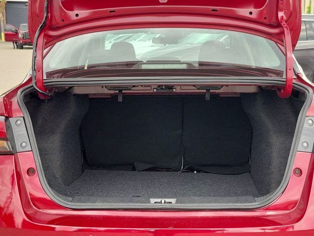 2025 Scarlet Ember Tintcoat Nissan Versa 1.6 SR FWD Sedan
