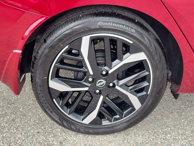 2025 Scarlet Ember Tintcoat Nissan Versa 1.6 SR FWD Sedan