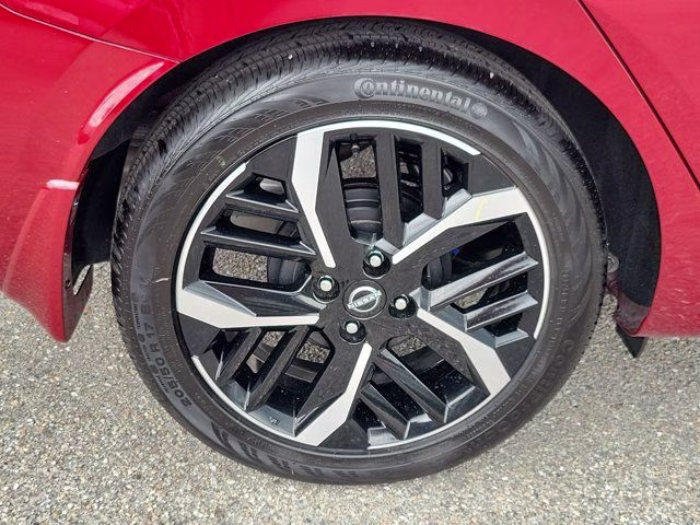 2025 Scarlet Ember Tintcoat Nissan Versa 1.6 SR FWD Sedan