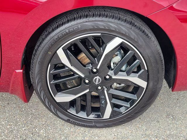 2025 Scarlet Ember Tintcoat Nissan Versa 1.6 SR FWD Sedan