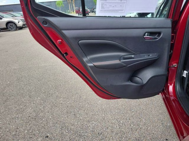 2025 Scarlet Ember Tintcoat Nissan Versa 1.6 SR FWD Sedan