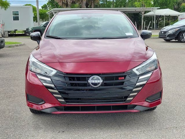 2025 Scarlet Ember Tintcoat Nissan Versa 1.6 SR FWD Sedan