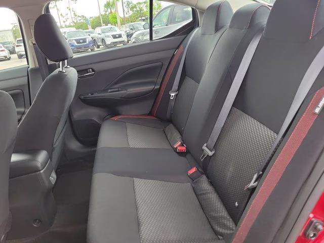 2025 Scarlet Ember Tintcoat Nissan Versa 1.6 SR FWD Sedan