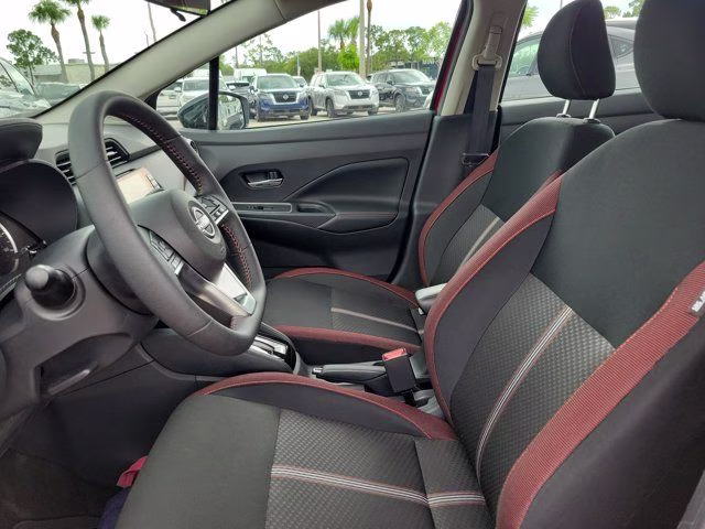 2025 Scarlet Ember Tintcoat Nissan Versa 1.6 SR FWD Sedan