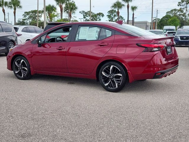 2025 Scarlet Ember Tintcoat Nissan Versa 1.6 SR FWD Sedan