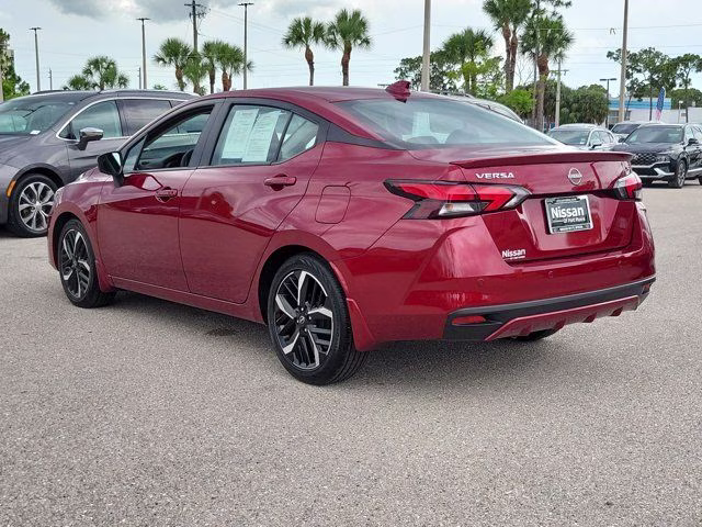 2025 Scarlet Ember Tintcoat Nissan Versa 1.6 SR FWD Sedan