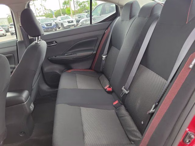 2025 Scarlet Ember Tintcoat Nissan Versa 1.6 SR FWD Sedan
