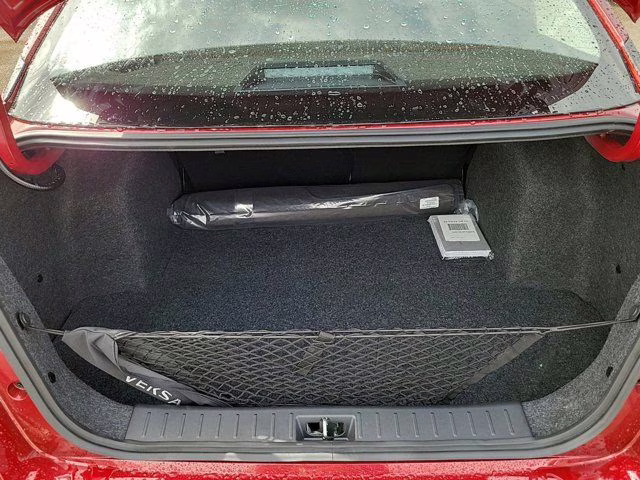 2025 Scarlet Ember Tintcoat Nissan Versa 1.6 SR FWD Sedan