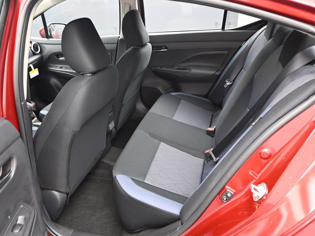 2025 Scarlet Ember Tintcoat Nissan Versa 1.6 SV FWD Sedan
