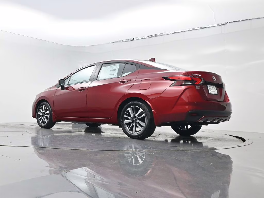 2025 Scarlet Ember Tintcoat Nissan Versa 1.6 SV FWD Sedan