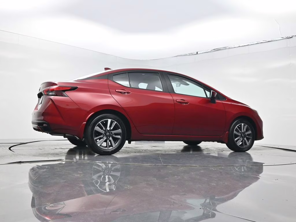 2025 Scarlet Ember Tintcoat Nissan Versa 1.6 SV FWD Sedan