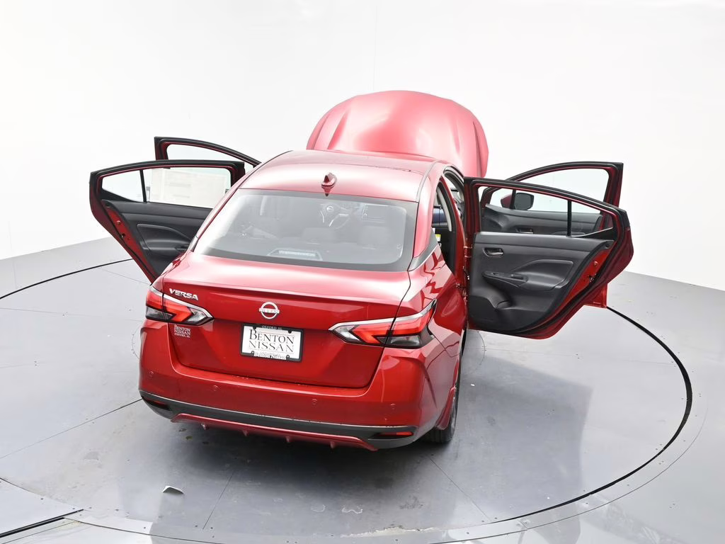 2025 Scarlet Ember Tintcoat Nissan Versa 1.6 SV FWD Sedan