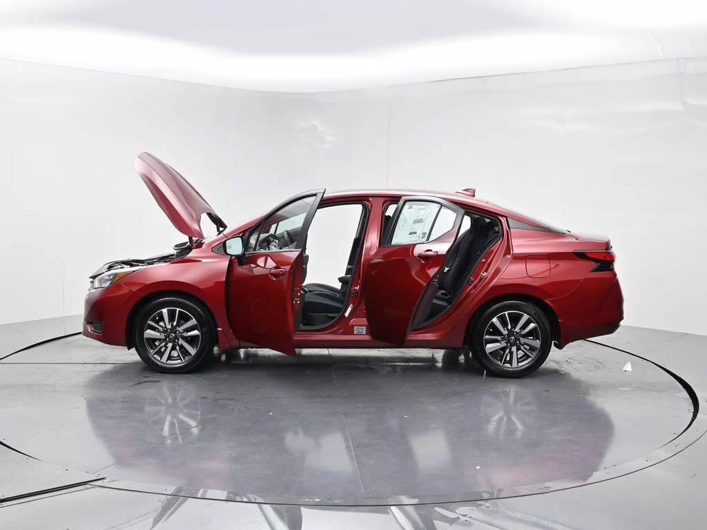 2025 Scarlet Ember Tintcoat Nissan Versa 1.6 SV FWD Sedan