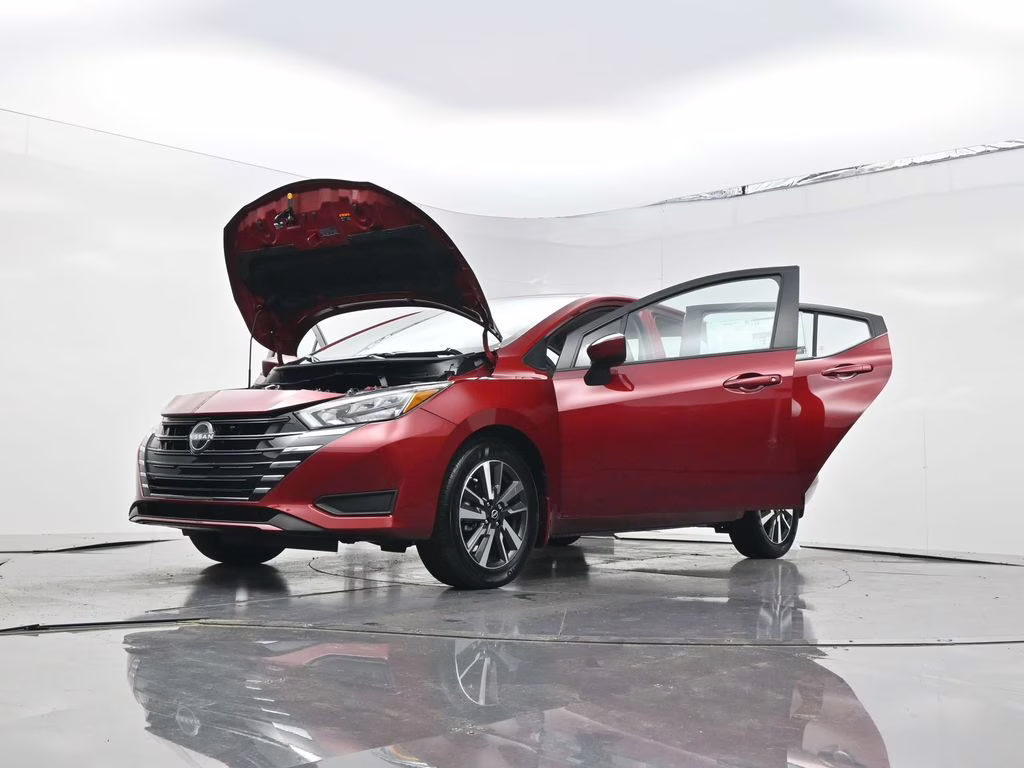 2025 Scarlet Ember Tintcoat Nissan Versa 1.6 SV FWD Sedan