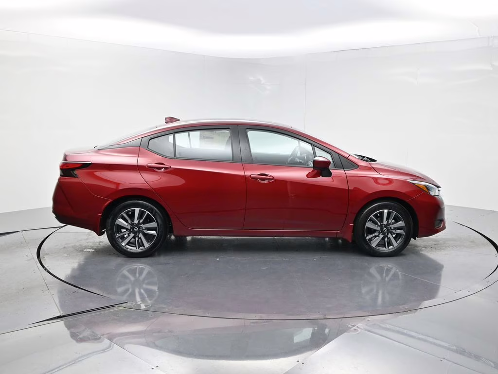 2025 Scarlet Ember Tintcoat Nissan Versa 1.6 SV FWD Sedan