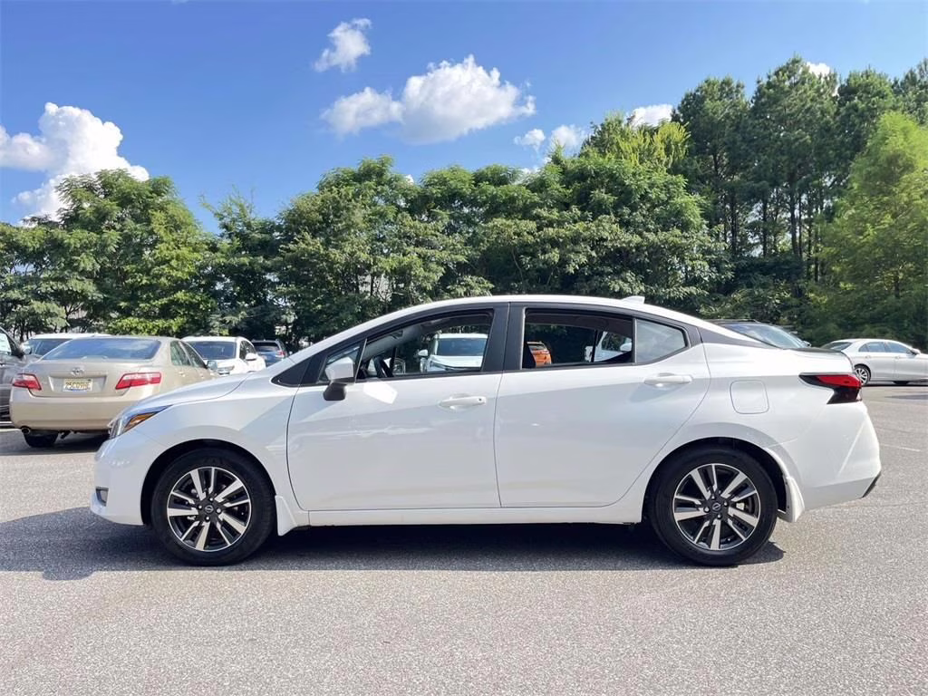 2025 Aspen White Tricoat Nissan Versa 1.6 SV FWD Sedan
