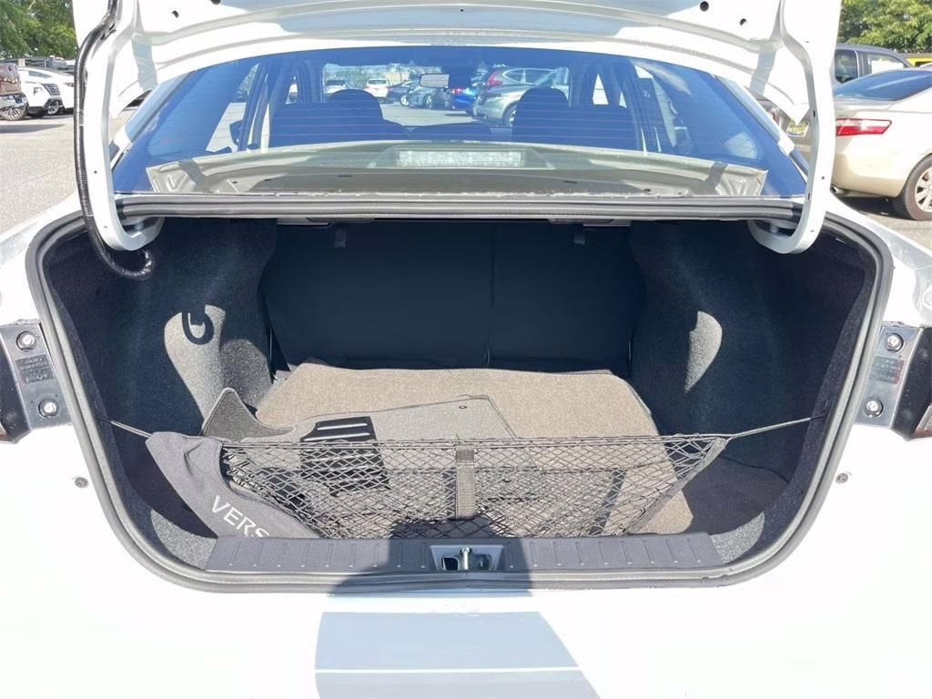 2025 Aspen White Tricoat Nissan Versa 1.6 SV FWD Sedan
