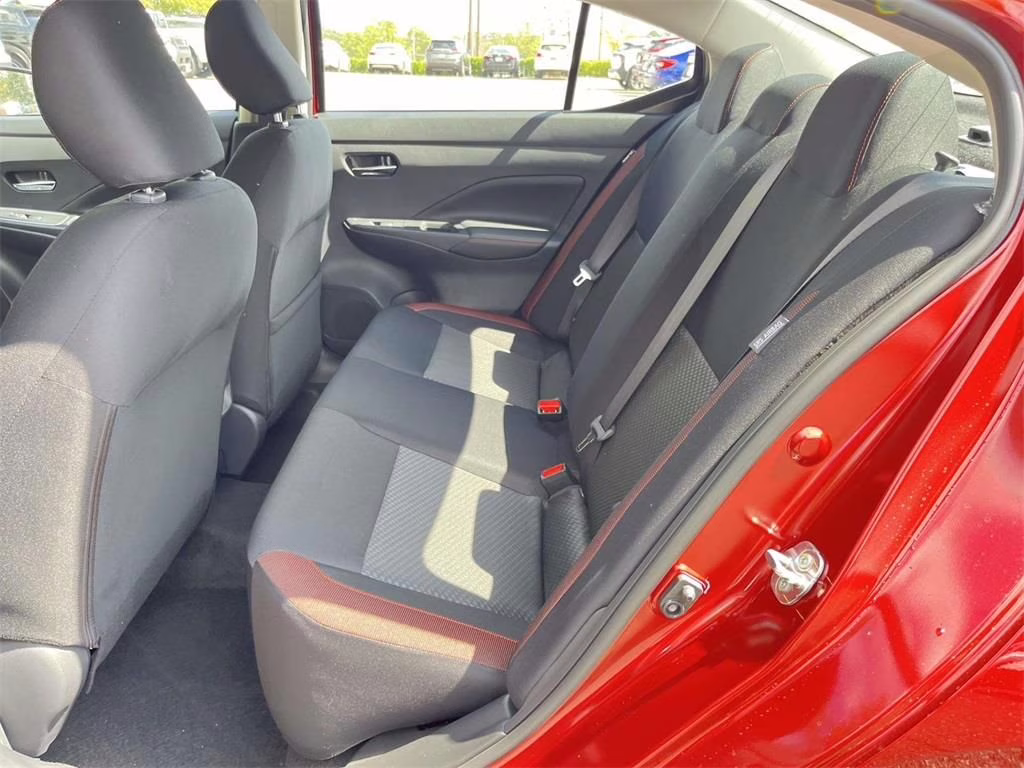 2025 Scarlet Ember Tintcoat Nissan Versa 1.6 SR FWD Sedan