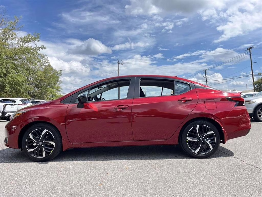 2025 Scarlet Ember Tintcoat Nissan Versa 1.6 SR FWD Sedan