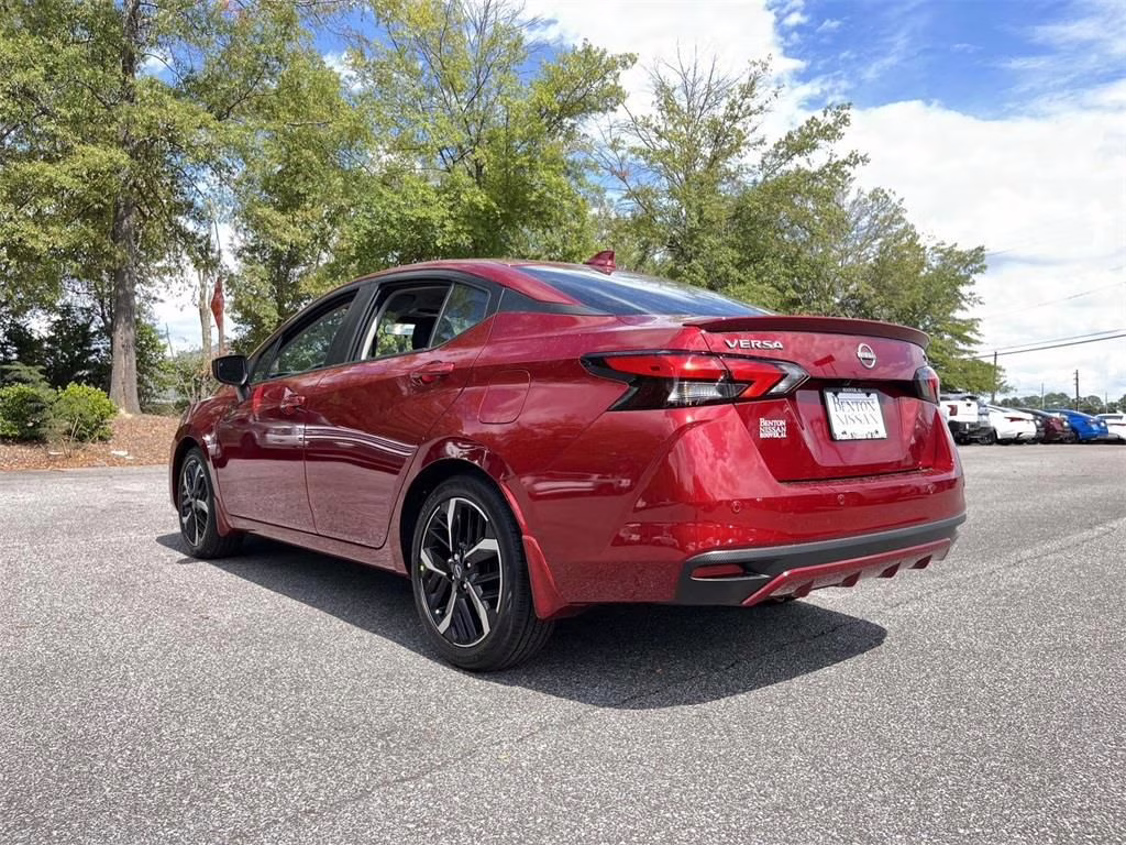 2025 Scarlet Ember Tintcoat Nissan Versa 1.6 SR FWD Sedan