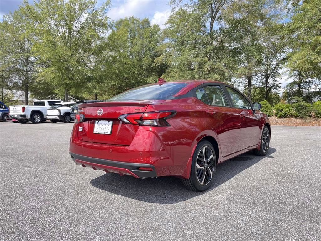 2025 Scarlet Ember Tintcoat Nissan Versa 1.6 SR FWD Sedan