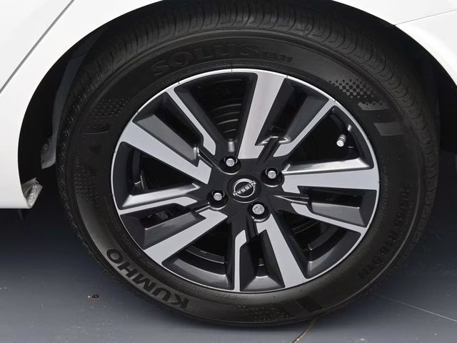 2025 Aspen White Tricoat Nissan Versa 1.6 SV FWD Sedan