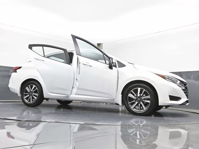 2025 Aspen White Tricoat Nissan Versa 1.6 SV FWD Sedan