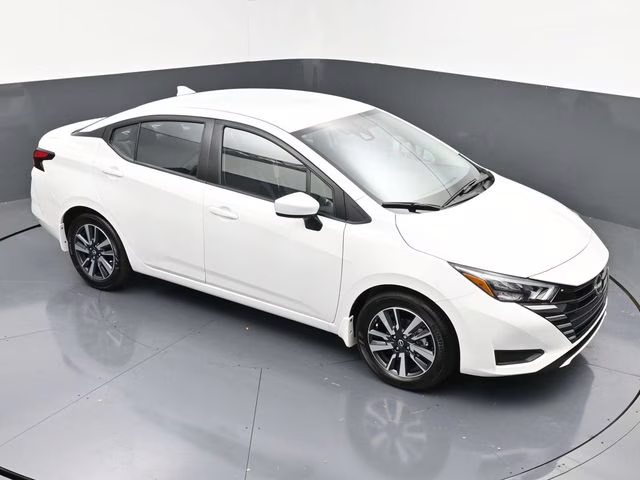 2025 Aspen White Tricoat Nissan Versa 1.6 SV FWD Sedan