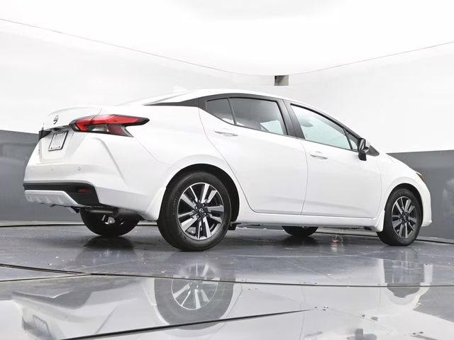 2025 Aspen White Tricoat Nissan Versa 1.6 SV FWD Sedan
