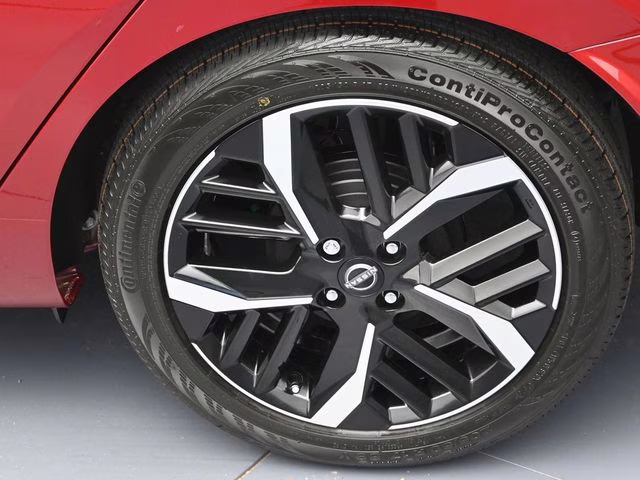 2025 Scarlet Ember Tintcoat Nissan Versa 1.6 SR FWD Sedan