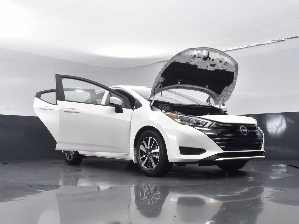 2025 Aspen White Tricoat Nissan Versa 1.6 SV FWD Sedan