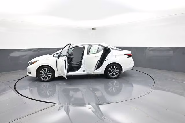2025 Aspen White Tricoat Nissan Versa 1.6 SV FWD Sedan