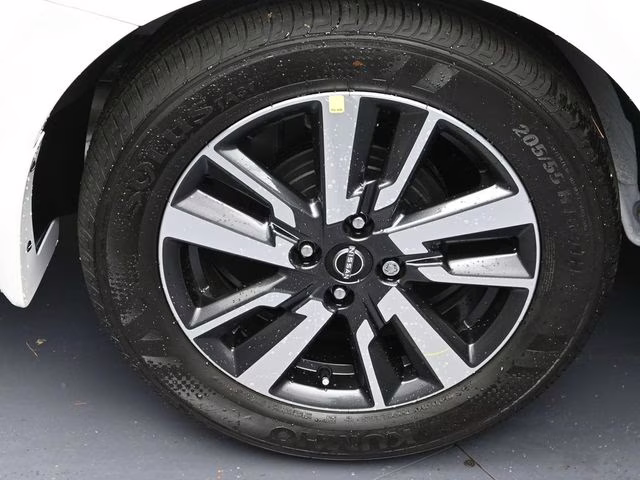 2025 Aspen White Tricoat Nissan Versa 1.6 SV FWD Sedan