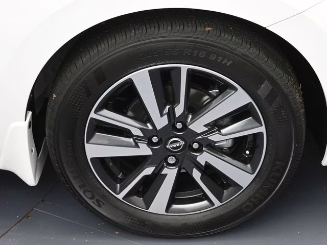 2025 Aspen White Tricoat Nissan Versa 1.6 SV FWD Sedan