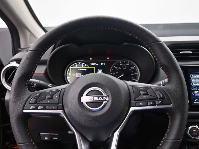 2025 Scarlet Ember Tintcoat Nissan Versa 1.6 SR FWD Sedan