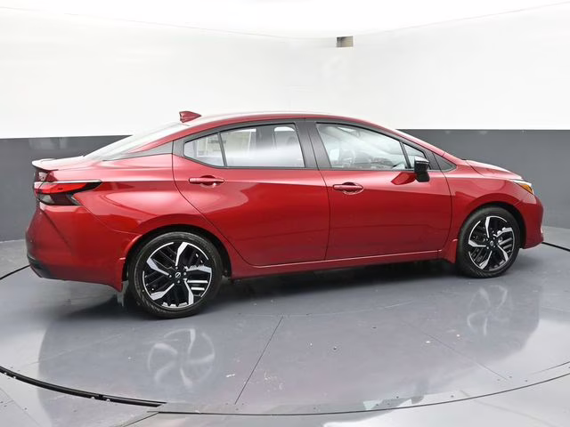 2025 Scarlet Ember Tintcoat Nissan Versa 1.6 SR FWD Sedan