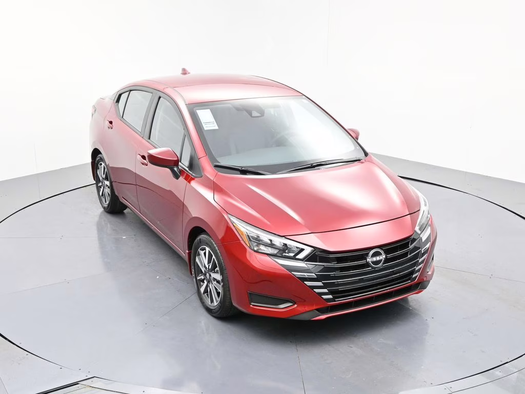 2025 Scarlet Ember Tintcoat Nissan Versa 1.6 SV FWD Sedan
