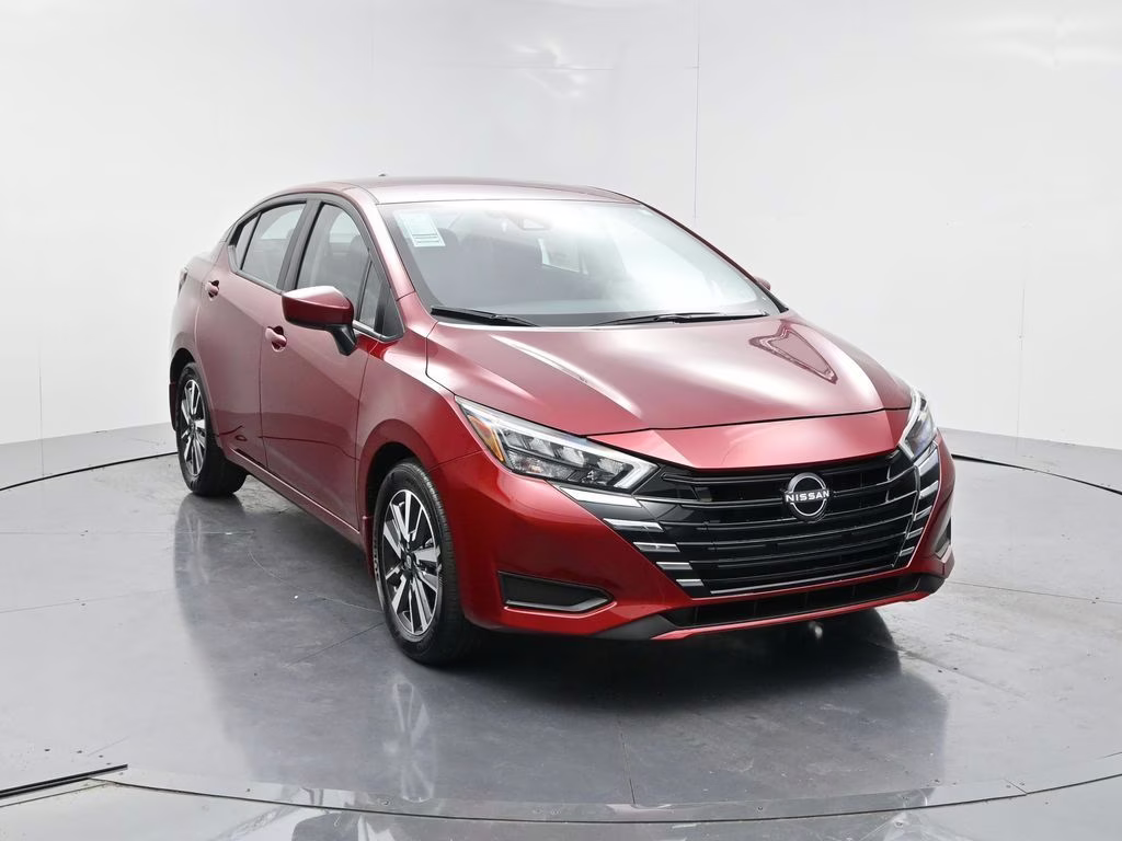 2025 Scarlet Ember Tintcoat Nissan Versa 1.6 SV FWD Sedan