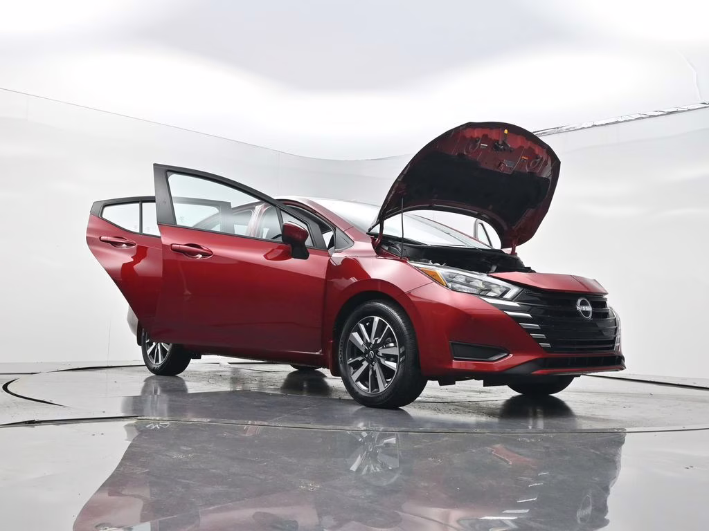 2025 Scarlet Ember Tintcoat Nissan Versa 1.6 SV FWD Sedan