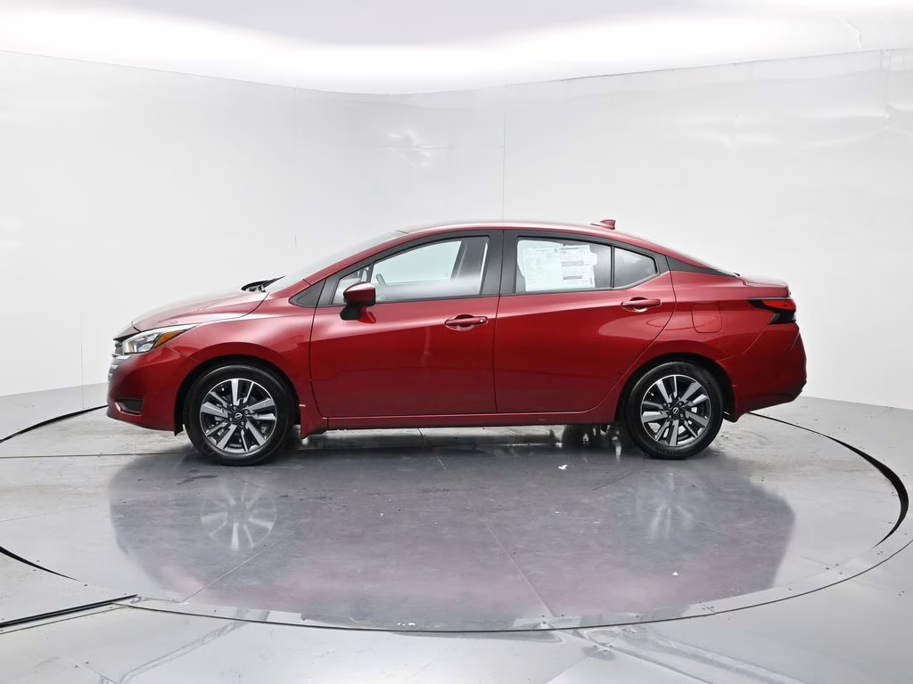 2025 Scarlet Ember Tintcoat Nissan Versa 1.6 SV FWD Sedan