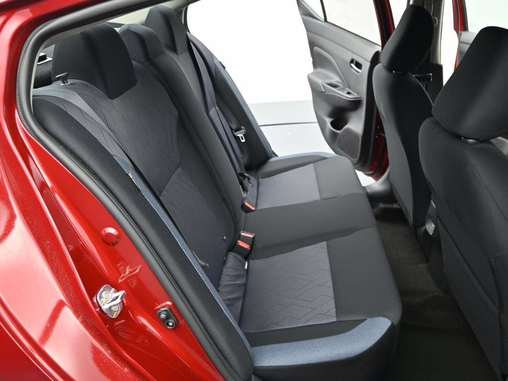 2025 Scarlet Ember Tintcoat Nissan Versa 1.6 SV FWD Sedan