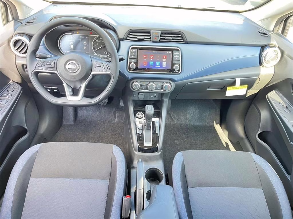 2025 Aspen White Tricoat Nissan Versa 1.6 SV FWD Sedan