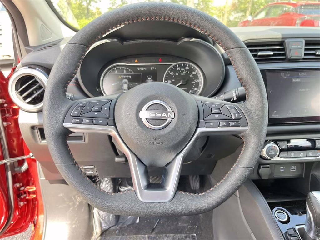2025 Scarlet Ember Tintcoat Nissan Versa 1.6 SR FWD Sedan
