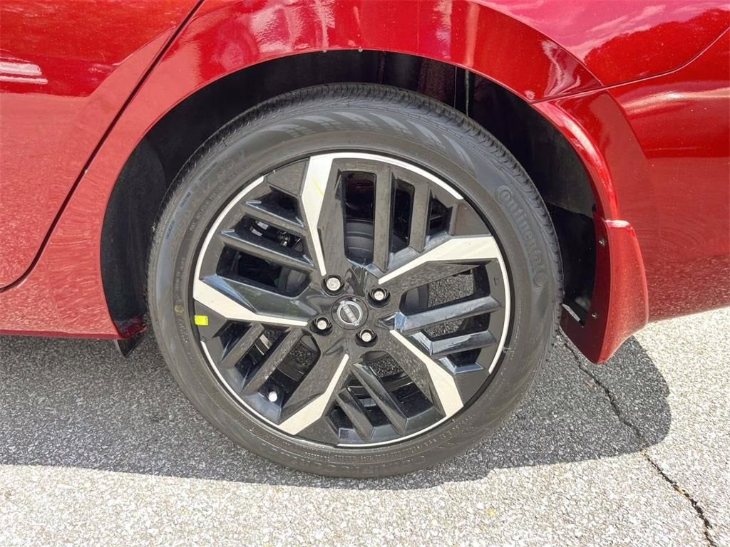 2025 Scarlet Ember Tintcoat Nissan Versa 1.6 SR FWD Sedan