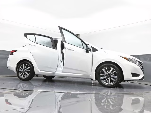 2025 Aspen White Tricoat Nissan Versa 1.6 SV FWD Sedan