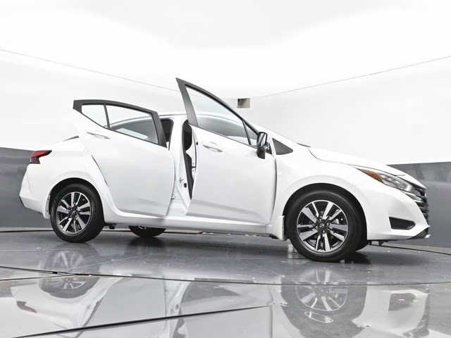 2025 Aspen White Tricoat Nissan Versa 1.6 SV FWD Sedan