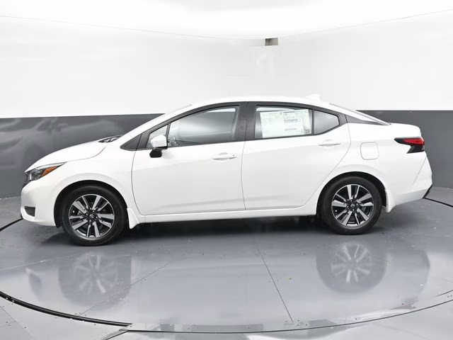 2025 Aspen White Tricoat Nissan Versa 1.6 SV FWD Sedan