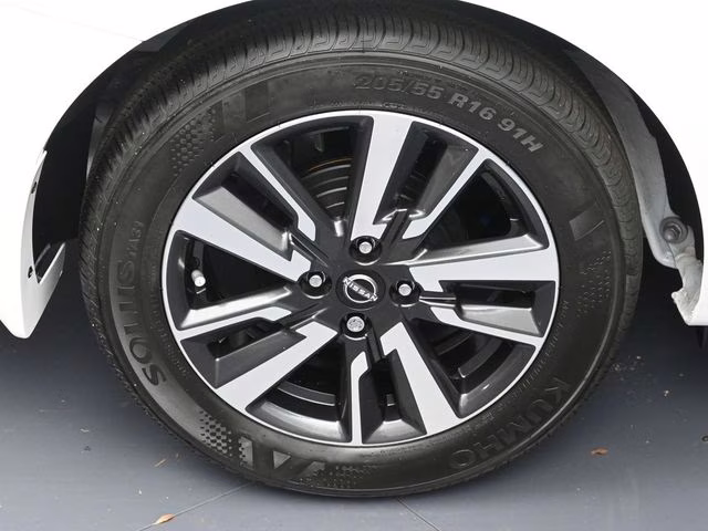 2025 Aspen White Tricoat Nissan Versa 1.6 SV FWD Sedan